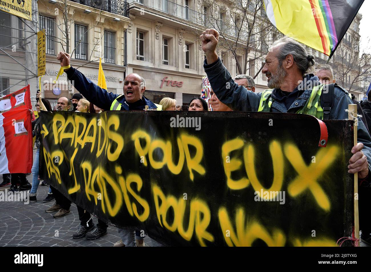 Marseille, France. 19th Mar, 2022. Protesters hold a banner and chant  slogans during the demonstration. Activists from the Yellow Vests (“Gilets  Jaunes” in french) movement took to the streets of Marseille in