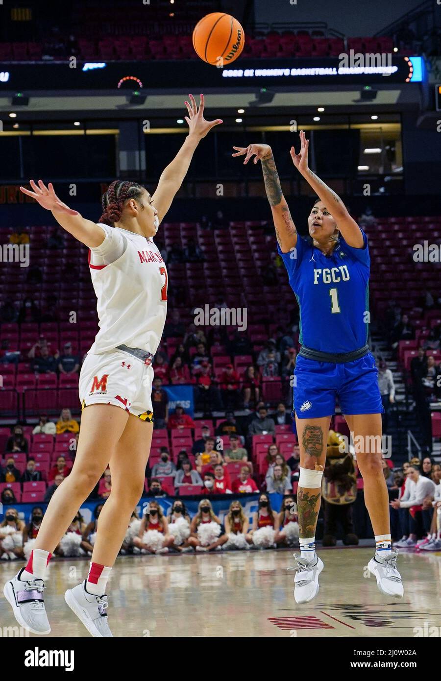 COLLEGE PARK, Maryland, USA - 20 MARCH 2022: Florida Gulf Coast Eagles guard Kierstan Bell (1) lobs a shot over Maryland Terrapins forward Mimi Collins (2) during a NCAA women's basketball tournament second round game between the Maryland Terrapins and the Florida Gulf Coast Eagles, on March 20, 2022, at Xfinity Center, in College Park, Maryland. (Photo by Tony Quinn-Alamy Live News) Stock Photo