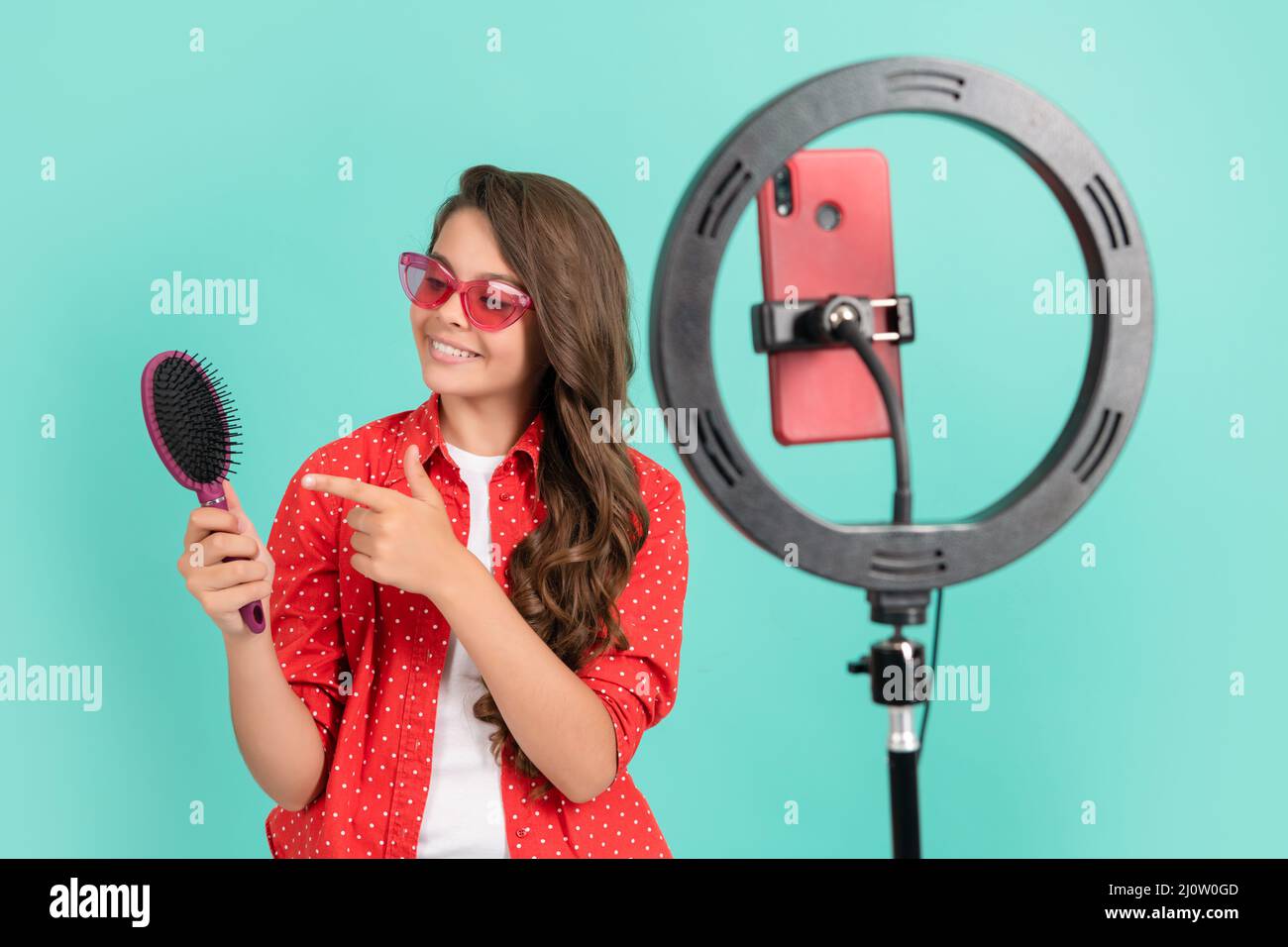 Teen girl brushing hair hi-res stock photography and images - Alamy