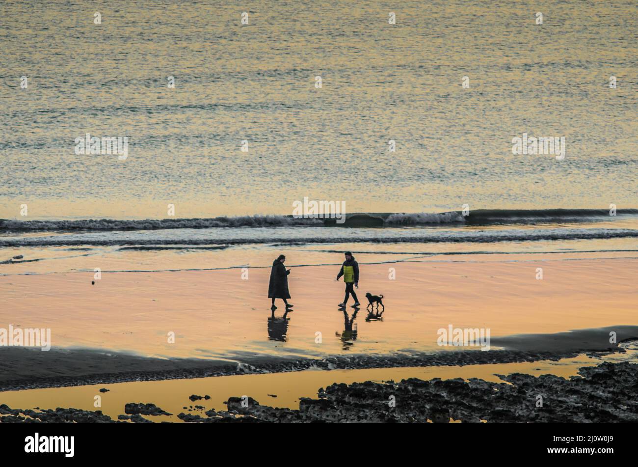 Birling Gap, Eastbourne, East Sussex, UK. 20th Mar, 2022. Twilight reflections on the sand after a glorious warm Spring day. Temperatur is falling rapidly & frost is forecast under clear skies. Credit: David Burr/Alamy Live News Stock Photo