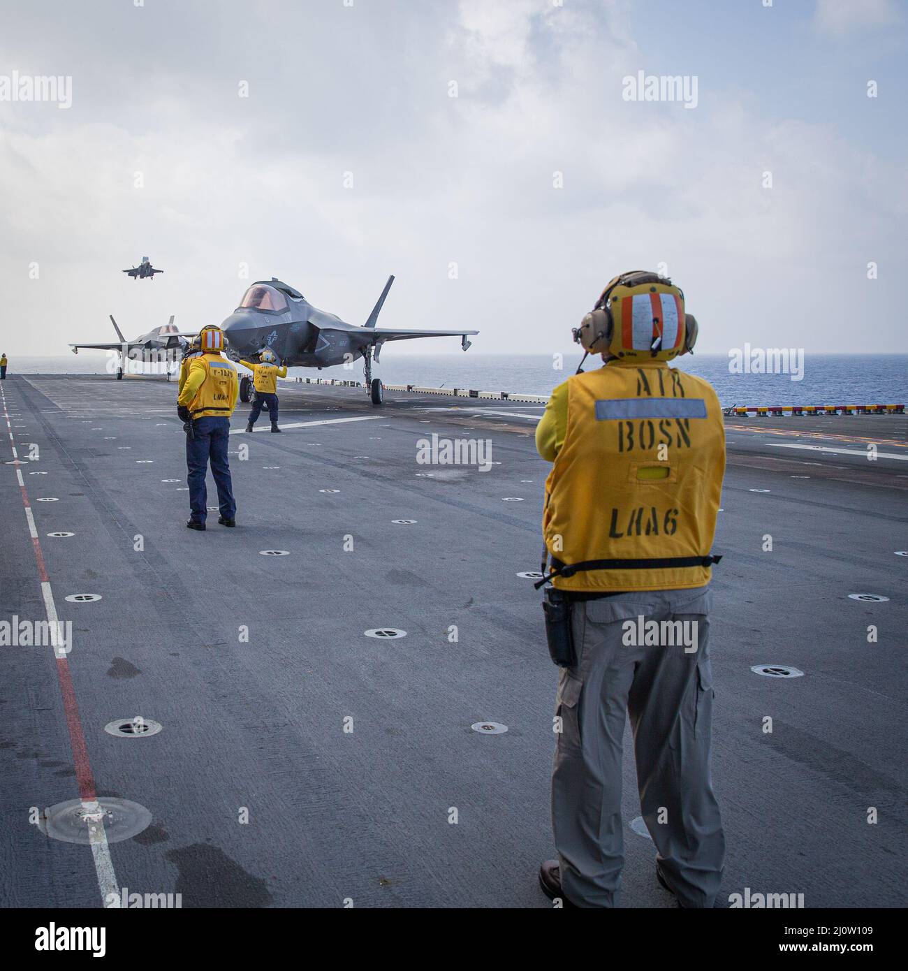 U.S. Navy Aviation Boatswains Mate Handlers ground guide F-35B ...