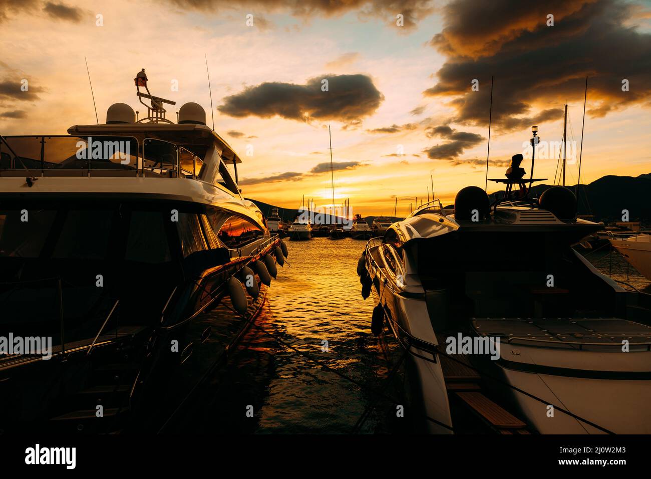 Yachts on the pier in Porto at sunset. Montenegro Stock Photo
