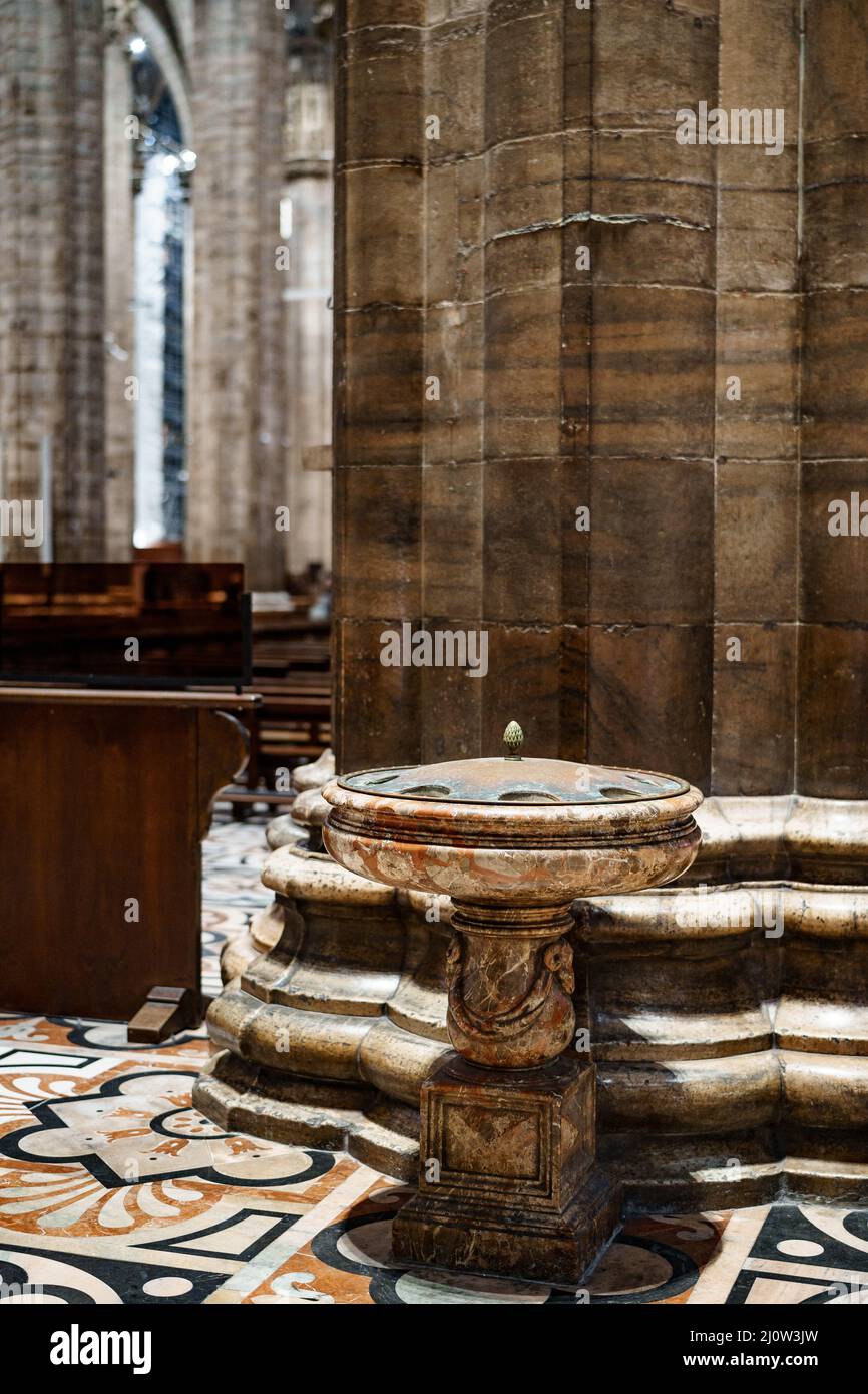 Stone bowl on a pedestal with a lid in the Duomo. Milan, Italy Stock Photo
