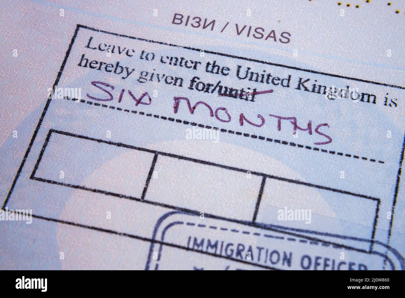 UK Visa stamp in Ukrainian passport for Ukrainian refugee, due to war in Ukraine. Stafford, United Kingdom, March 20, 2022 Stock Photo