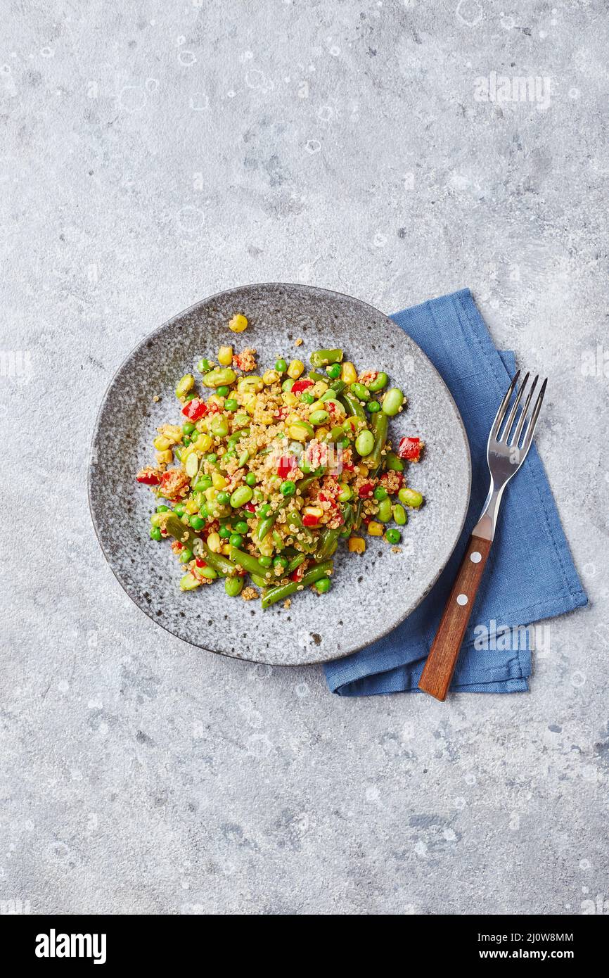 Quinoa salad with green beans, corn, red bell peppers, peas and