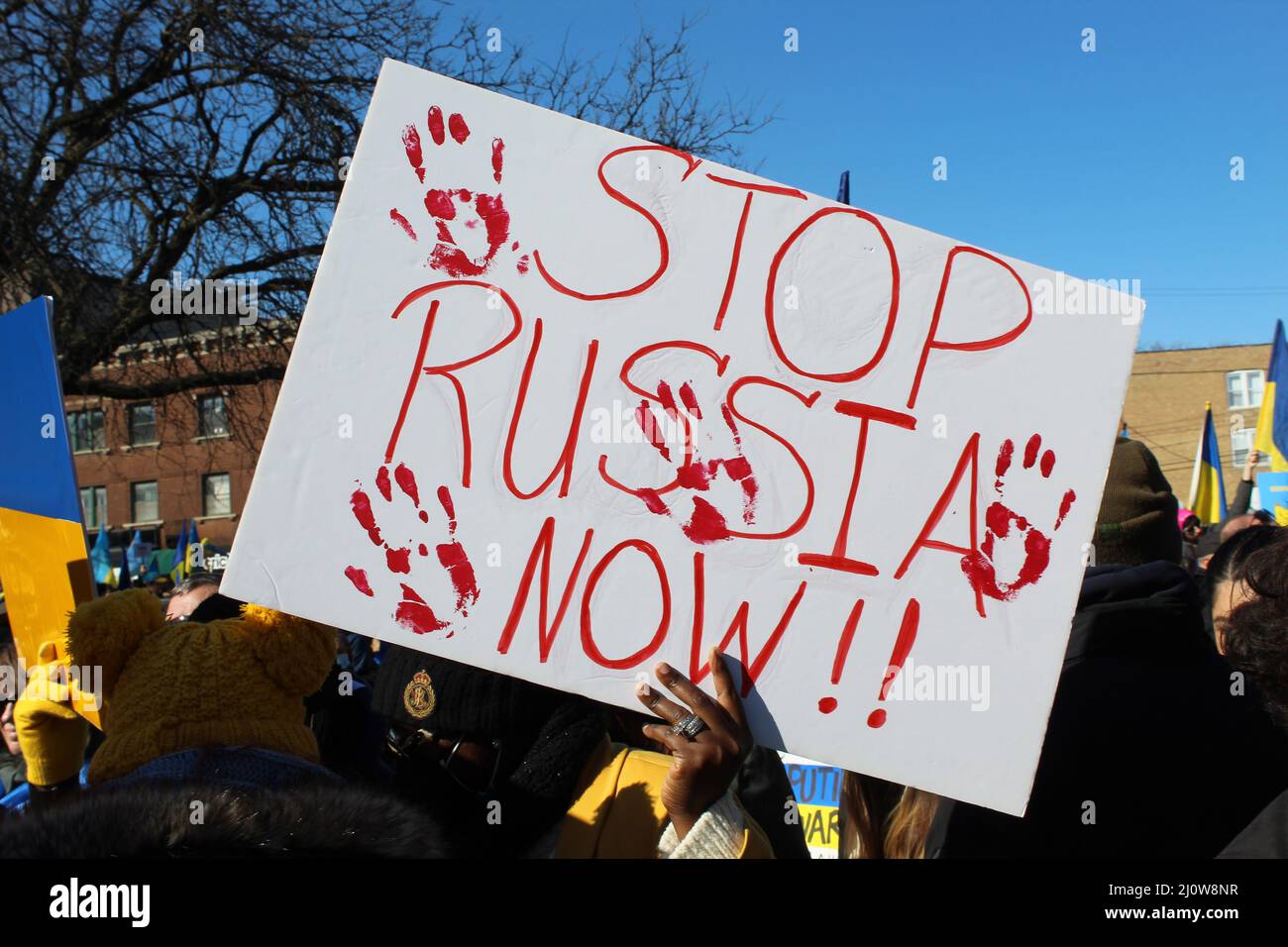 Stop Russia Now protest sign with blood handprints at Ukrainian Village in Chicago Stock Photo