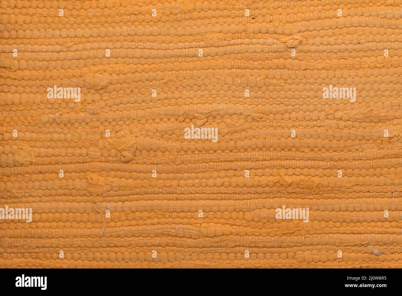 Background with orange floor carpet - woven carpet Stock Photo