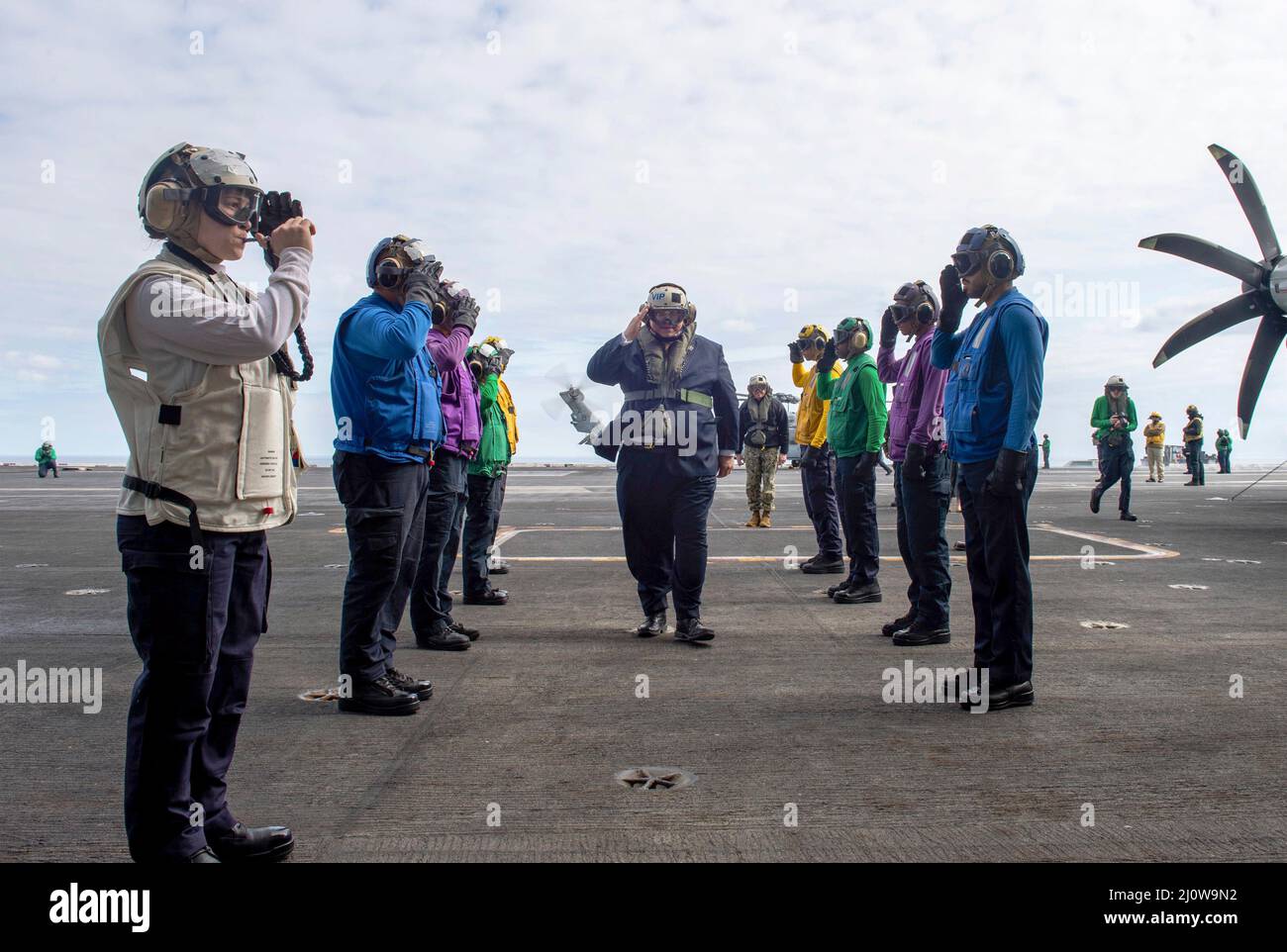 Ionian Sea, Greece. 17 March, 2022. U.S. Secretary of the Navy Carlos Del Toro salutes as he makes way past the sideboys after arriving aboard the aircraft carrier USS Harry S. Truman, March 17, 2022 in the Ionian Sea.  Credit: MC2 Kelsey Trinh/US Navy/Alamy Live News Stock Photo