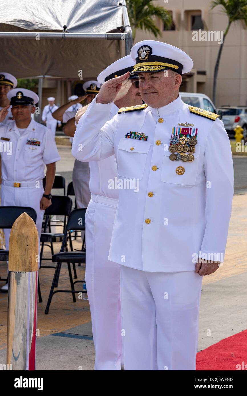 Honolulu, United States. 18 March, 2022. U.S. Navy Rear Adm. Timothy Kott, Commander, Naval Surface Group Middle Pacific, is piped aboard during a change of command ceremony at Joint Base Pearl Harbor-Hickam, March 18, 2022 in Honolulu, Hawaii.  Credit: MC2 Greg Hall/US Navy/Alamy Live News Stock Photo