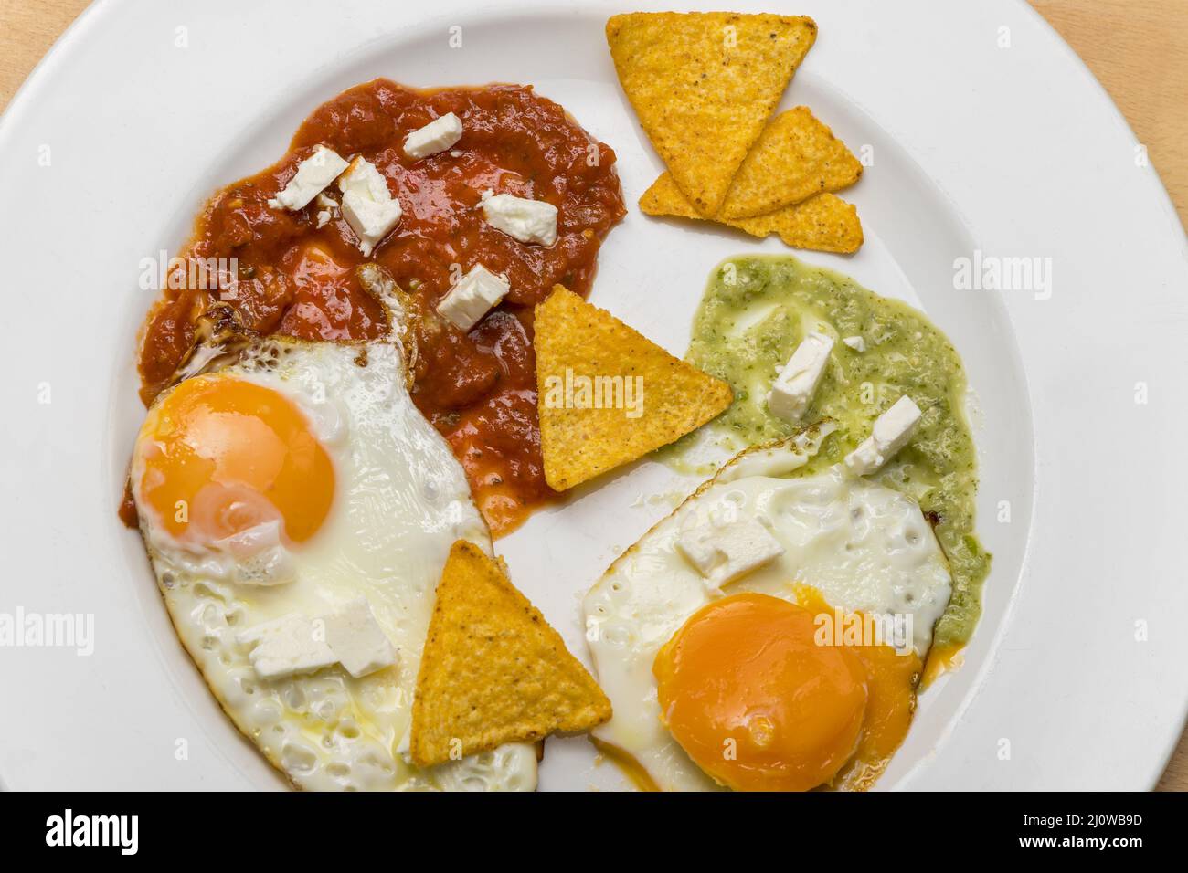 Mexican fried eggs with salsa Stock Photo