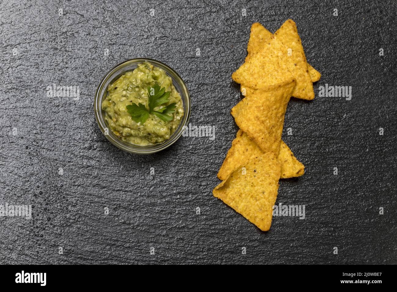 Small portion of guacamole on slate Stock Photo