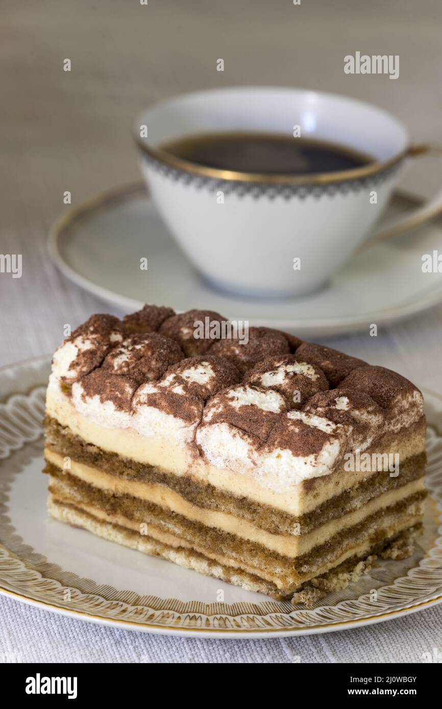 Tiramisu on a plate with coffee Stock Photo