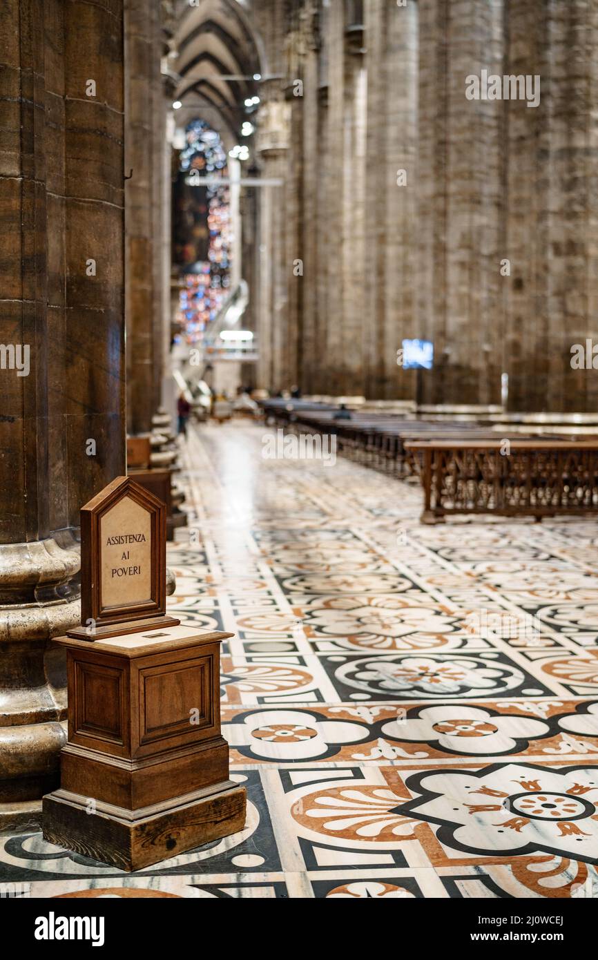Donation box in the Duomo cathedral. Milan, Italy Stock Photo