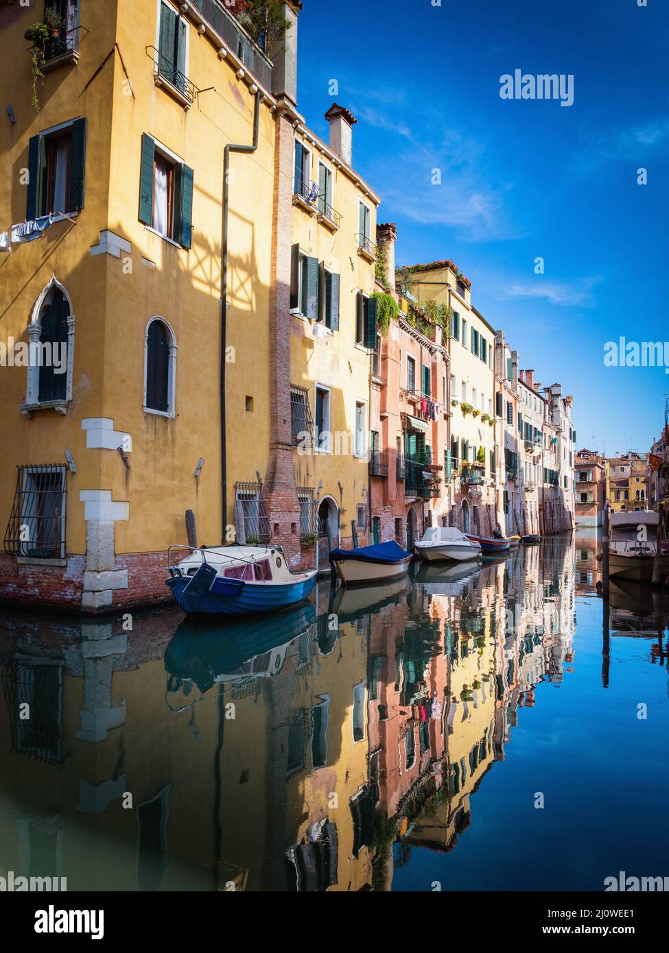 Colorful houses in the old medieval street in Venice, Italy Stock Photo