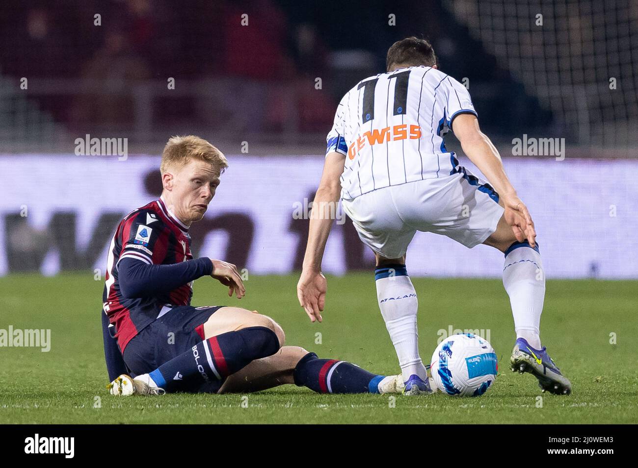Bologna, Italy. 20 March, 2022. Jerdy Schouten of Bologna FC competes for the ball with Remo Freuler of Atalanta BC  during the Serie A match between Bologna FC and Atalanta BC at Stadio Renato Dall'Ara on March 20, 2022. Credit: Ciancaphoto Studio/Alamy Live News Stock Photo