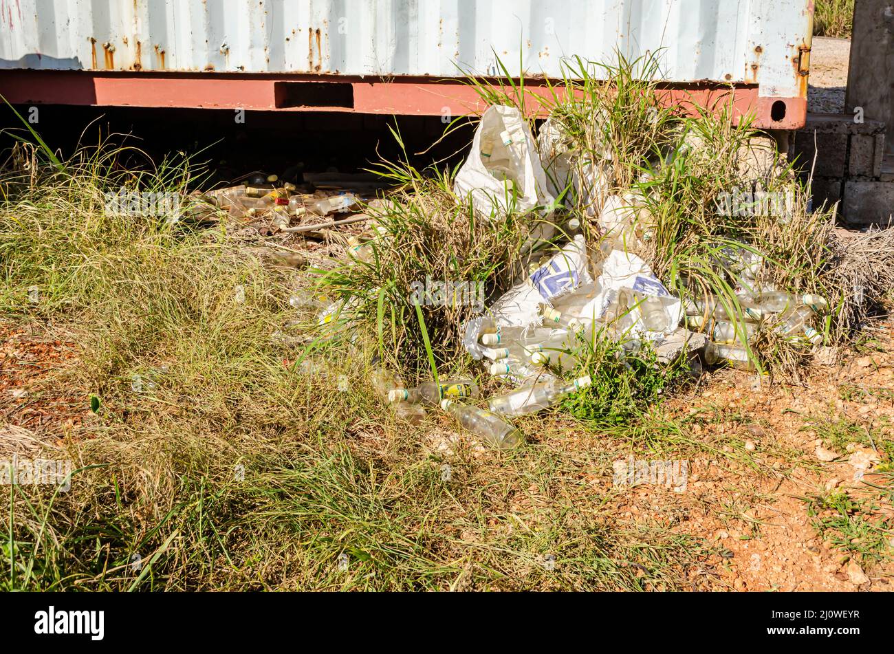 Bottles Dumped At The Back Of A Container Stock Photo - Alamy