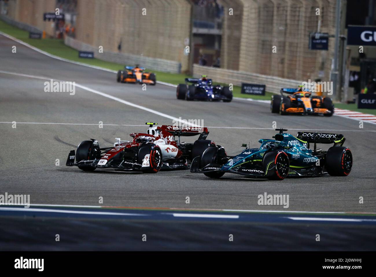 (220321) -- SAKHIR, March 21, 2022 (Xinhua) -- Alfa Romeo's Chinese driver Zhou Guanyu (L) competes during the Bahrain Formula One Grand Prix at the Bahrain International Circuit in the city of Sakhir on March 20, 2022. (DPPI/Handout via Xinhua) Stock Photo