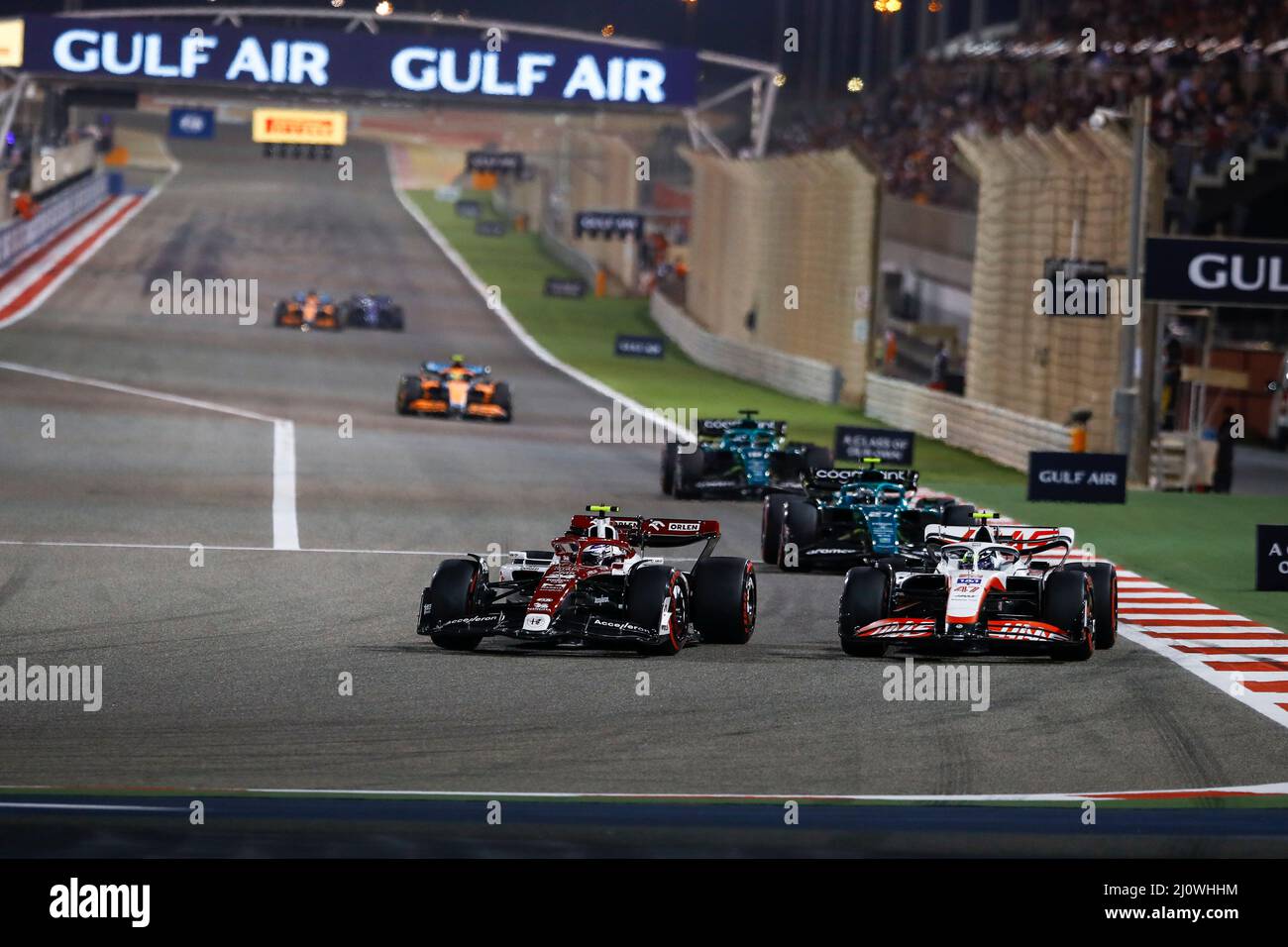 (220321) -- SAKHIR, March 21, 2022 (Xinhua) -- Alfa Romeo's Chinese driver Zhou Guanyu (fromt L) competes during the Bahrain Formula One Grand Prix at the Bahrain International Circuit in the city of Sakhir on March 20, 2022. (DPPI/Handout via Xinhua) Stock Photo