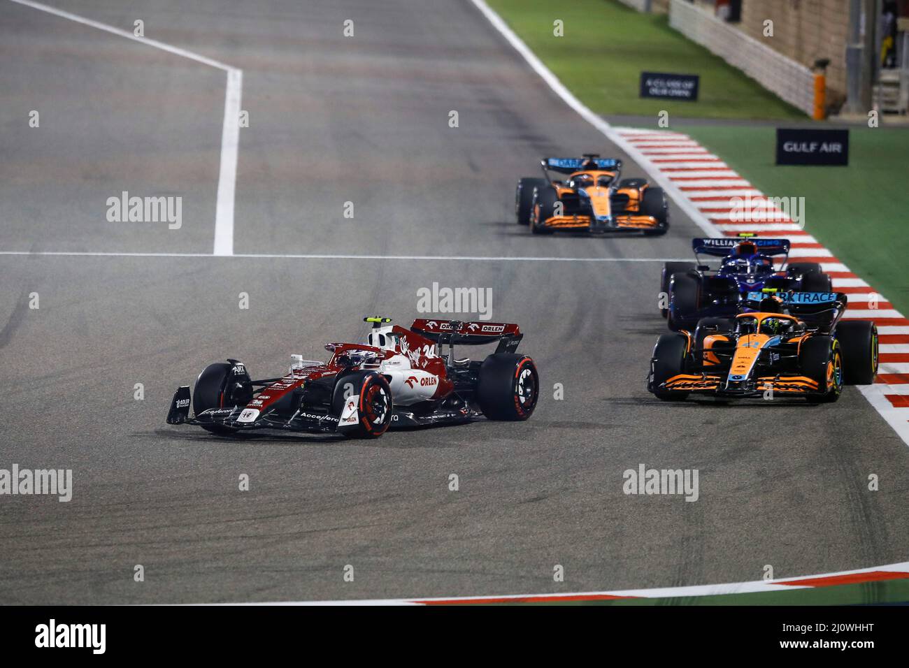 (220321) -- SAKHIR, March 21, 2022 (Xinhua) -- Alfa Romeo's Chinese driver Zhou Guanyu (L) competes during the Bahrain Formula One Grand Prix at the Bahrain International Circuit in the city of Sakhir on March 20, 2022. (DPPI/Handout via Xinhua) Stock Photo