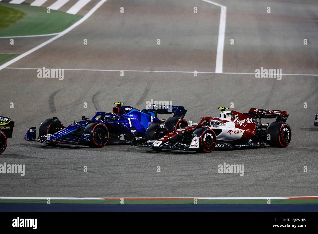 (220321) -- SAKHIR, March 21, 2022 (Xinhua) -- Alfa Romeo's Chinese driver Zhou Guanyu (R) competes during the Bahrain Formula One Grand Prix at the Bahrain International Circuit in the city of Sakhir on March 20, 2022. (DPPI/Handout via Xinhua) Stock Photo