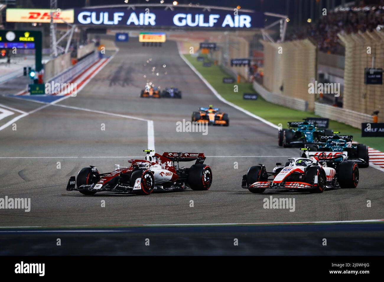 (220321) -- SAKHIR, March 21, 2022 (Xinhua) -- Alfa Romeo's Chinese driver Zhou Guanyu (L) competes during the Bahrain Formula One Grand Prix at the Bahrain International Circuit in the city of Sakhir on March 20, 2022. (DPPI/Handout via Xinhua) Stock Photo