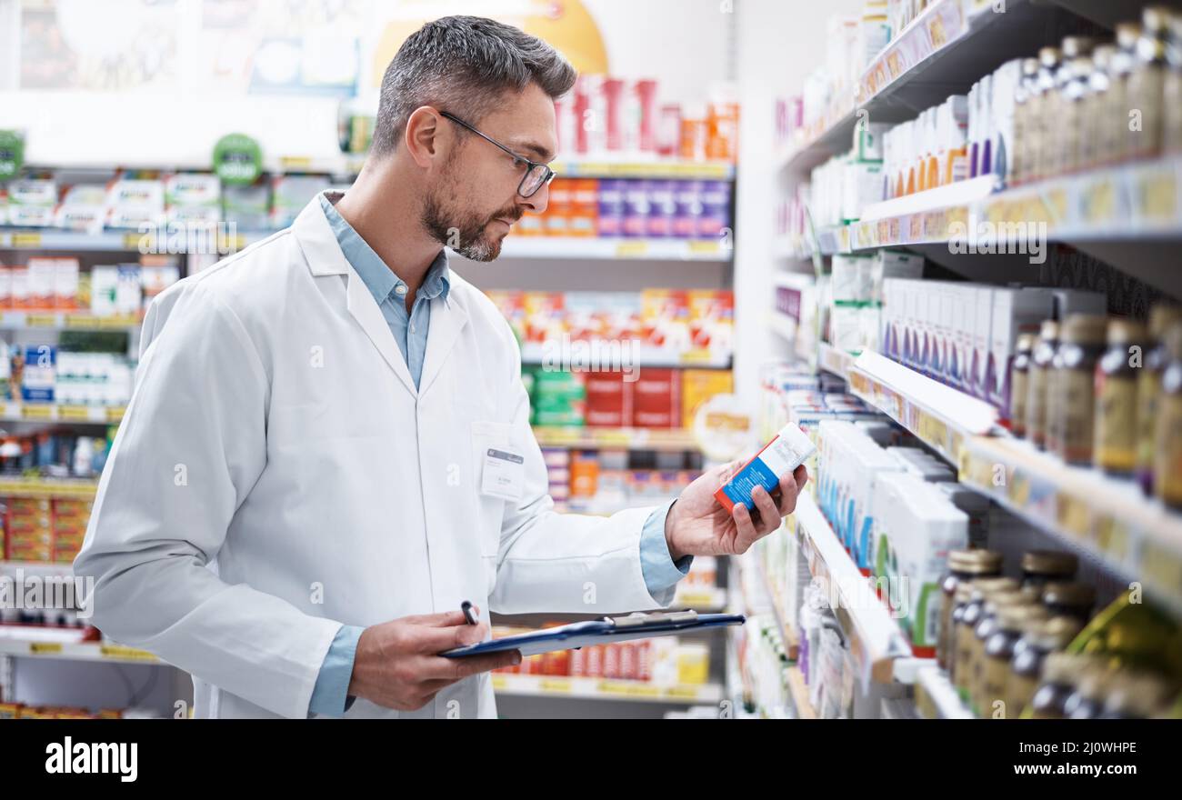 Stocking the shelves is top priority. Shot of a mature pharmacist doing