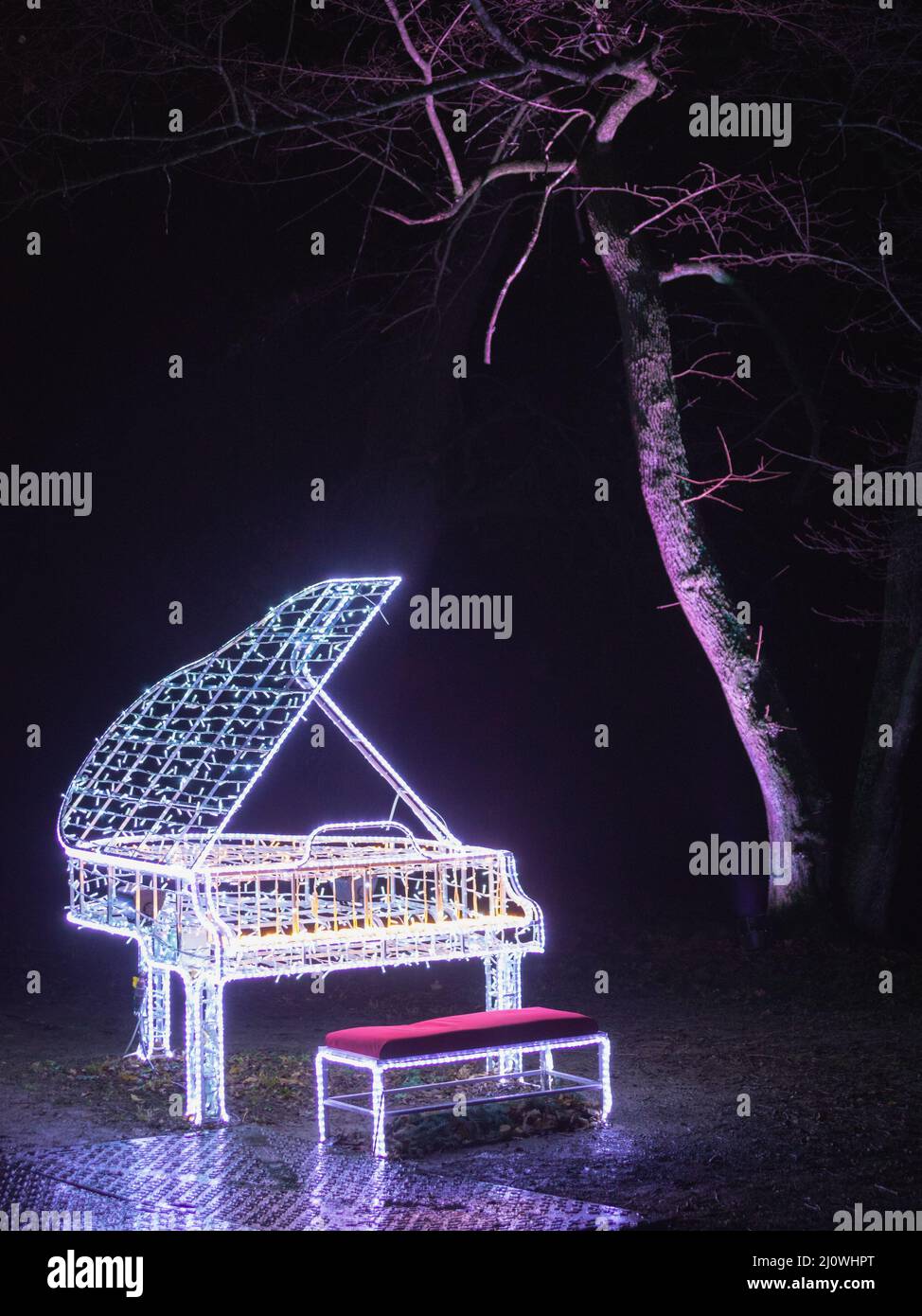 Christmas lights on a piano keyboard Stock Photo