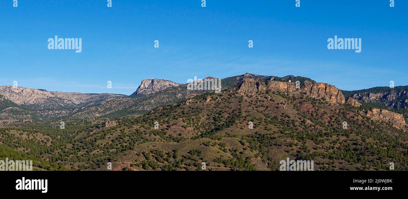 Landscape view of Spanish semi-desert with low green vegetation and mountains Stock Photo