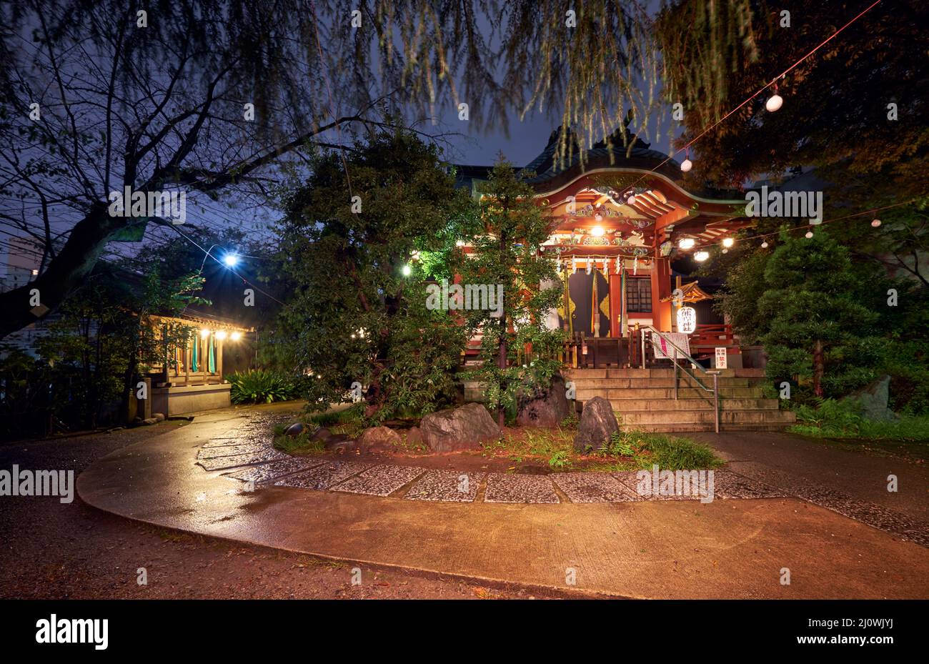 Small local shrine in Shibuya at night. Tokyo. Japan Stock Photo