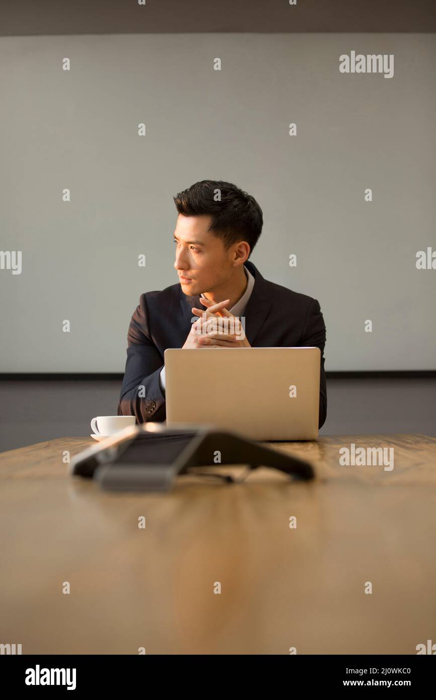 Chinese businessman use laptops for office work Stock Photo