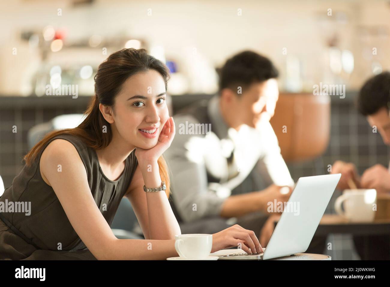 Beautiful Chinese woman work in cafe Stock Photo