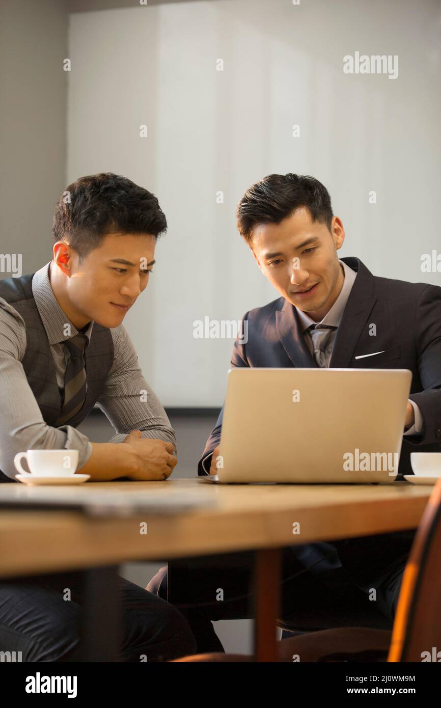 Chinese businessmen planning in office meeting room Stock Photo