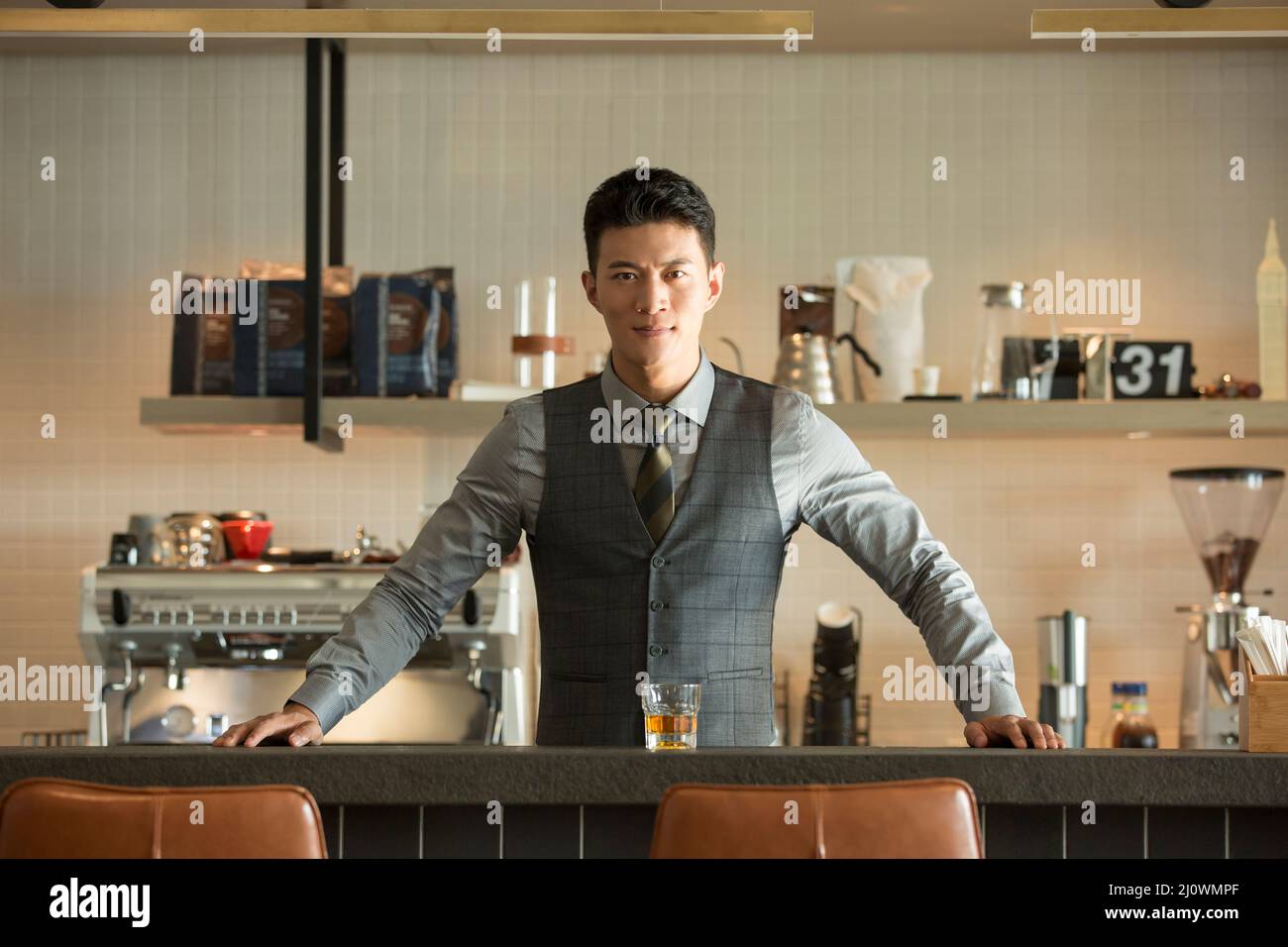 Portrait Of Chinese young man in bar Stock Photo