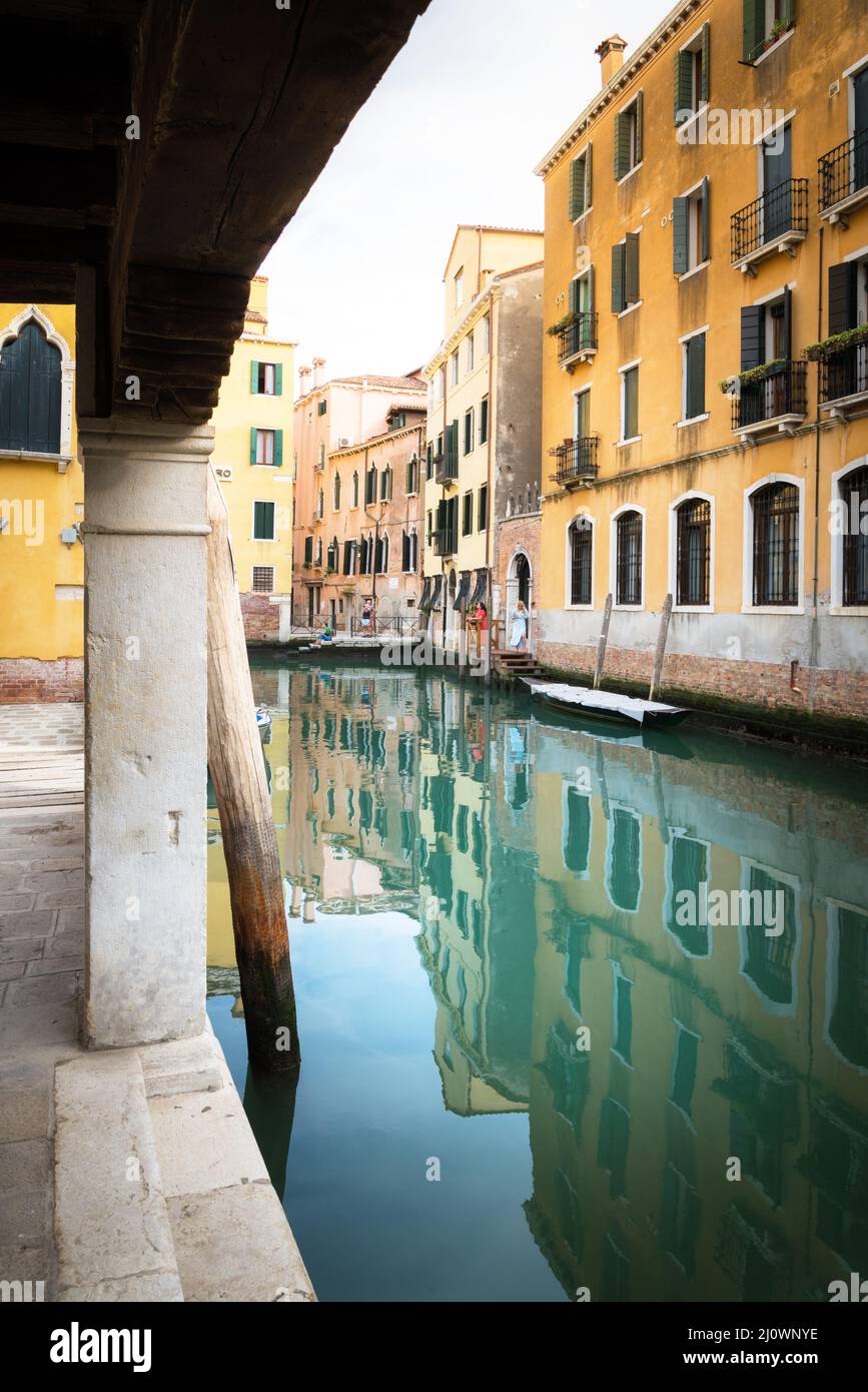 Small canal between houses in Venice Stock Photo - Alamy