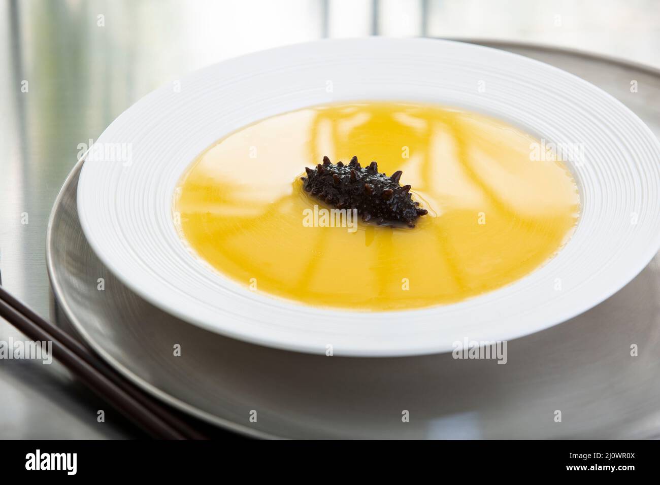 Cantonese Cuisine,Sea cucumber soup in a bowl Stock Photo