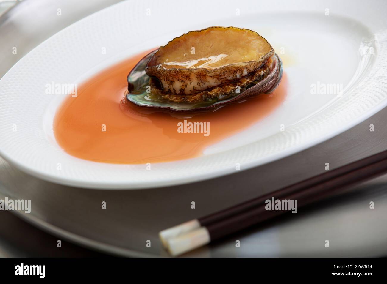 Cantonese cuisine,Close-up of abalone in brown sauce Stock Photo