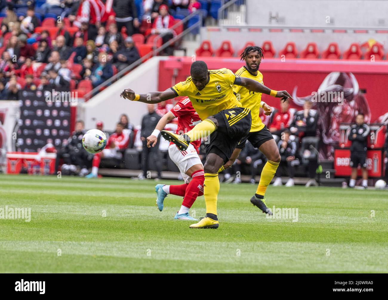Harrison, USA. 20th Mar, 2022. Jonathan Mensah (4) of Columbus Crew licks ball during MLS regular 2022 season game against Red Bulls at Red Bull Arena in Harrison, New Jersey on March 20, 2022. Game ended in draw 1 - 1. (Photo by Lev Radin/Sipa USA) Credit: Sipa USA/Alamy Live News Stock Photo