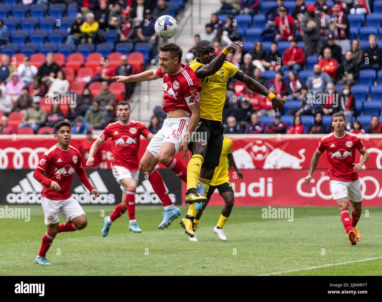 Harrison, NJ - March 20, 2022: Aaron Long (33) of Red Bulls and Jonathan Mensah (4) of Columbus Crew fight for ball during MLS regular 2022 season game at Red Bull Arena Stock Photo