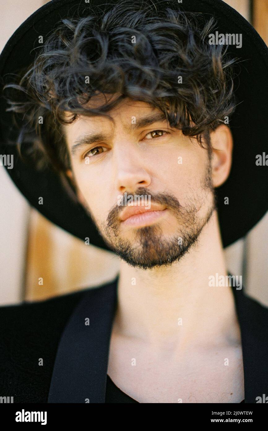 Man in black jacket hat hi-res stock photography and images - Alamy
