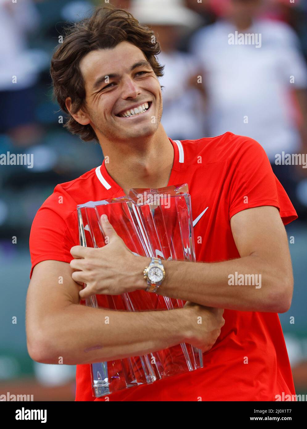 Indian Wells, California, USA. March 20, 2022 Taylor Fritz holds the  winner's trophy after defeating Rafael Nadal of Spain during the finals  match of the 2022 BNP Paribas Open at Indian Wells