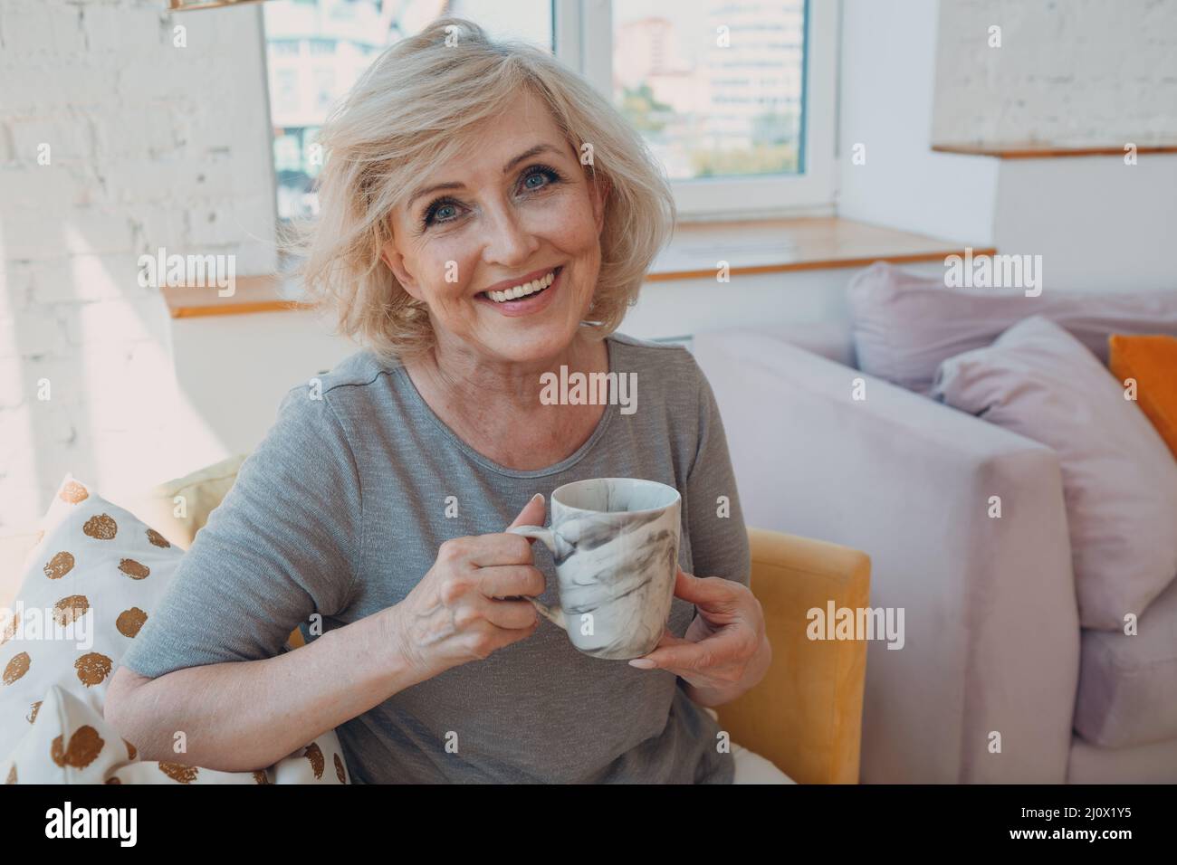 Elderly caucasian old aged woman enjoying afternoon tea at home Stock ...