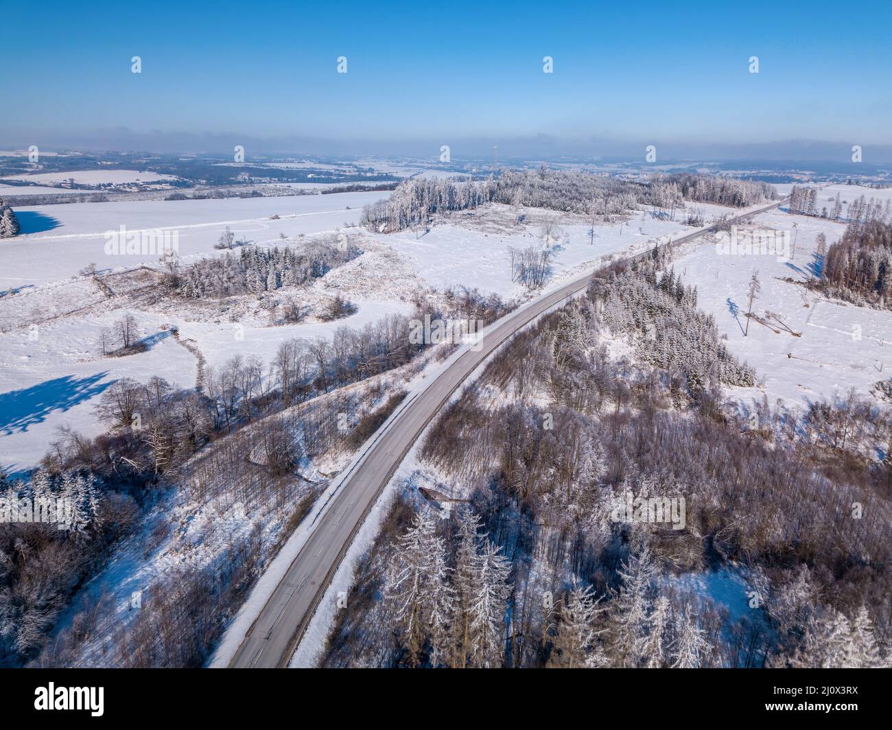 Aerial view of winter road, in sunny day Stock Photo