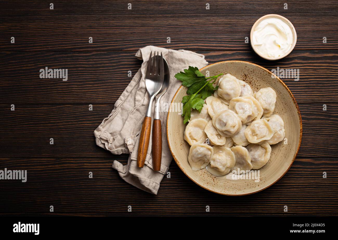 Pelmeni, traditional dish of Russian cuisine, boiled dumplings with ...