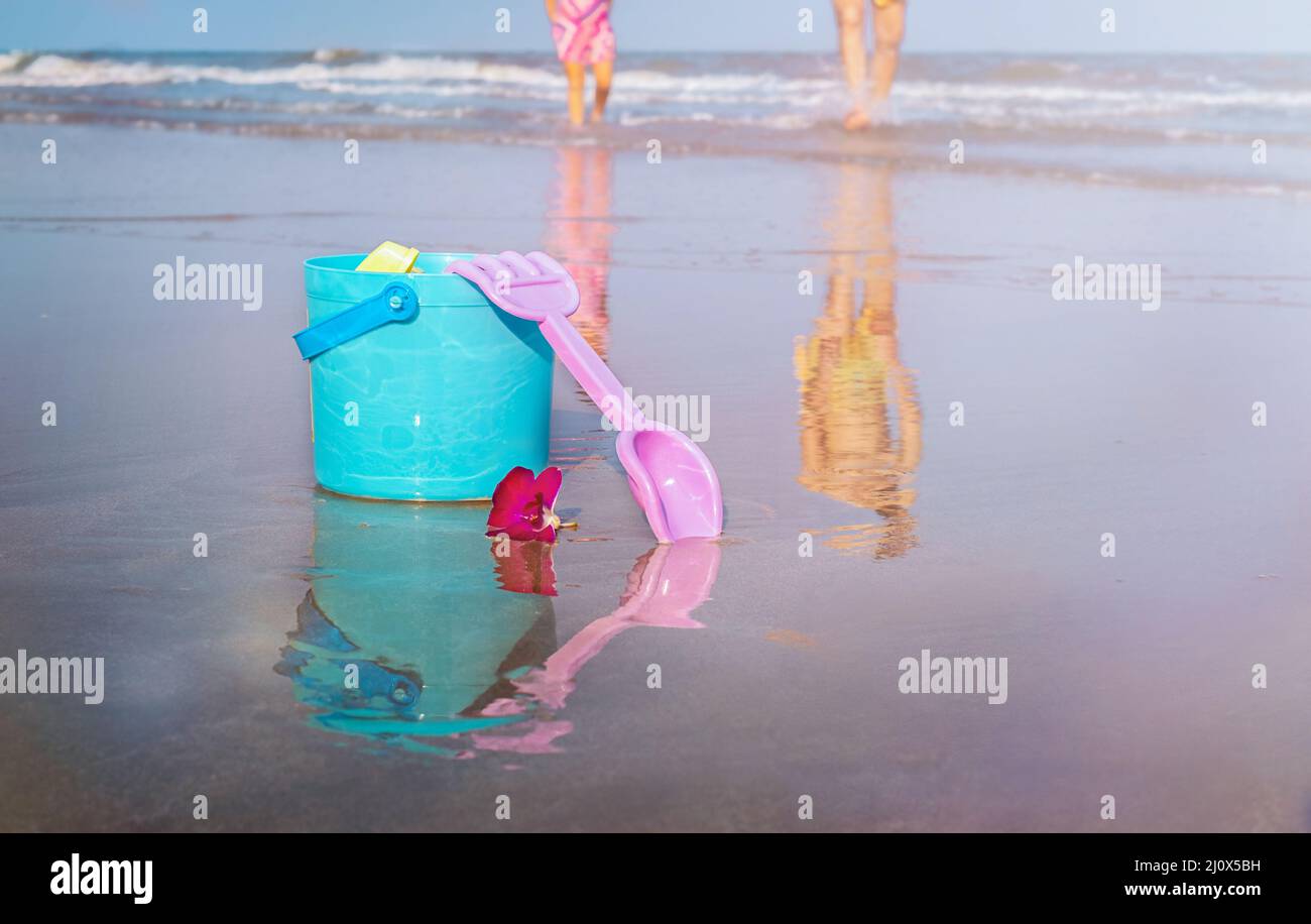 Bucket and scoop in the sand on the beach on vacation Stock Photo
