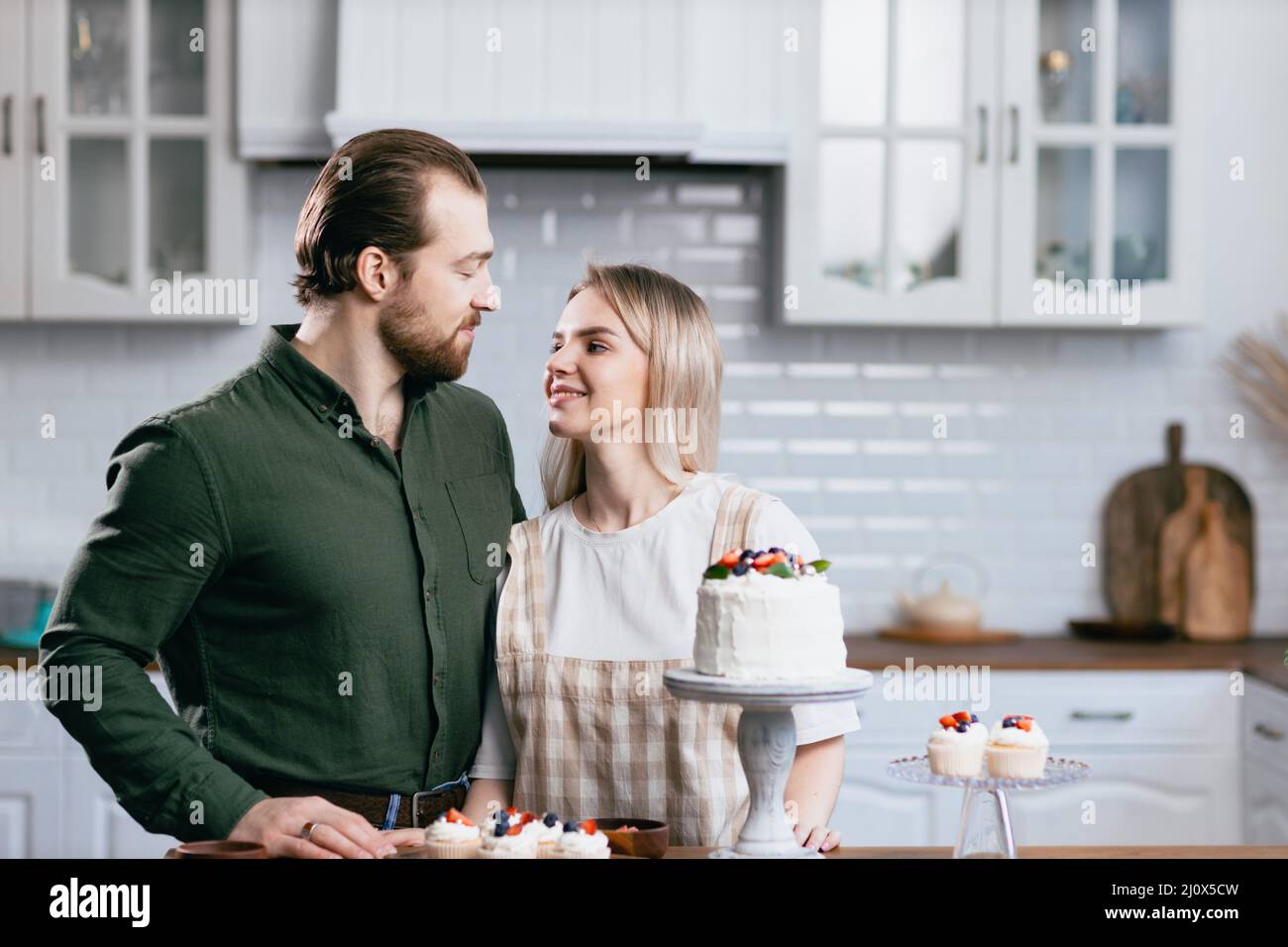 Pastry chef confectioner young caucasian woman with husband boyfriend