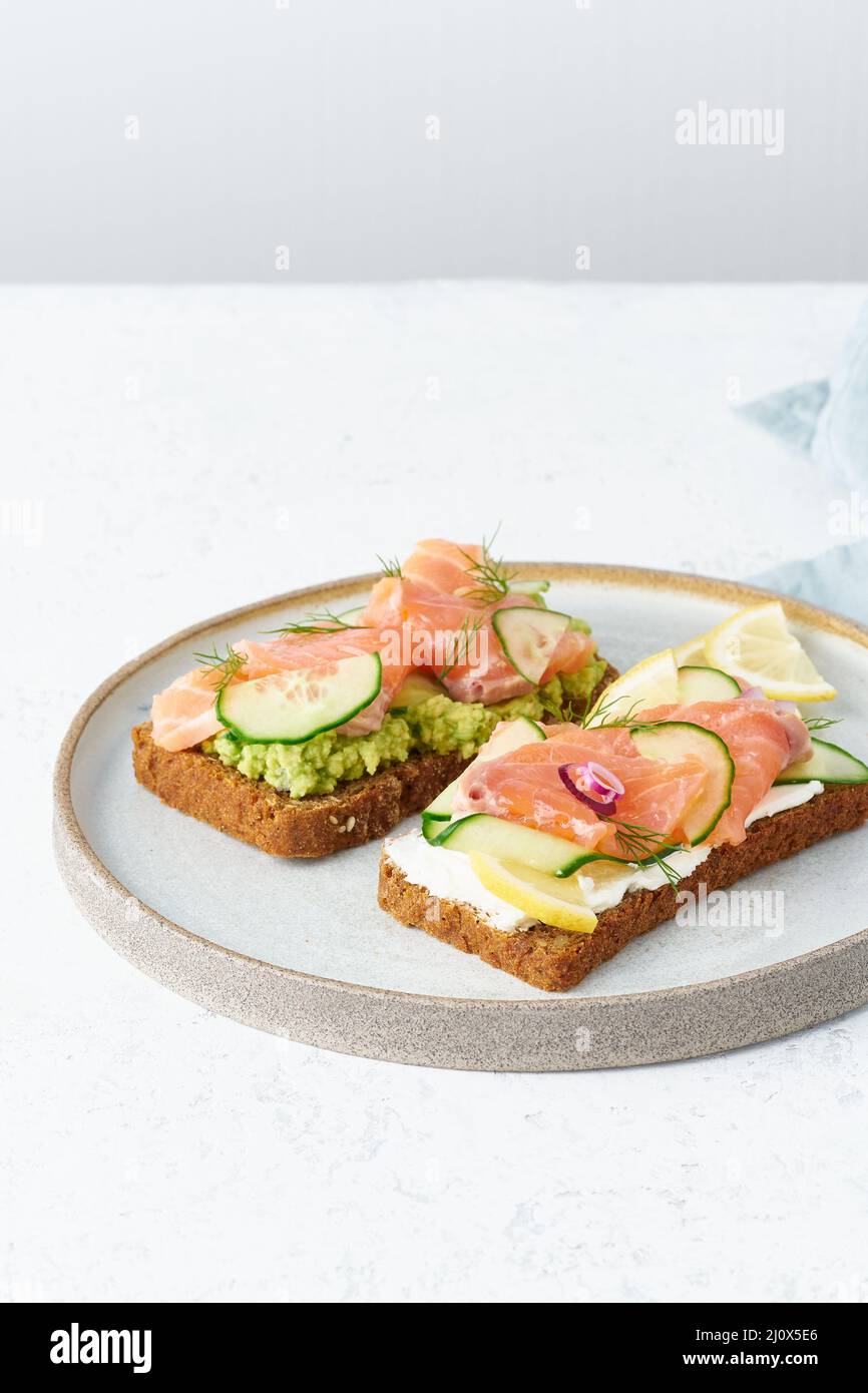 Smorrebrod - traditional Danish sandwiches. Black rye bread with salmon ...