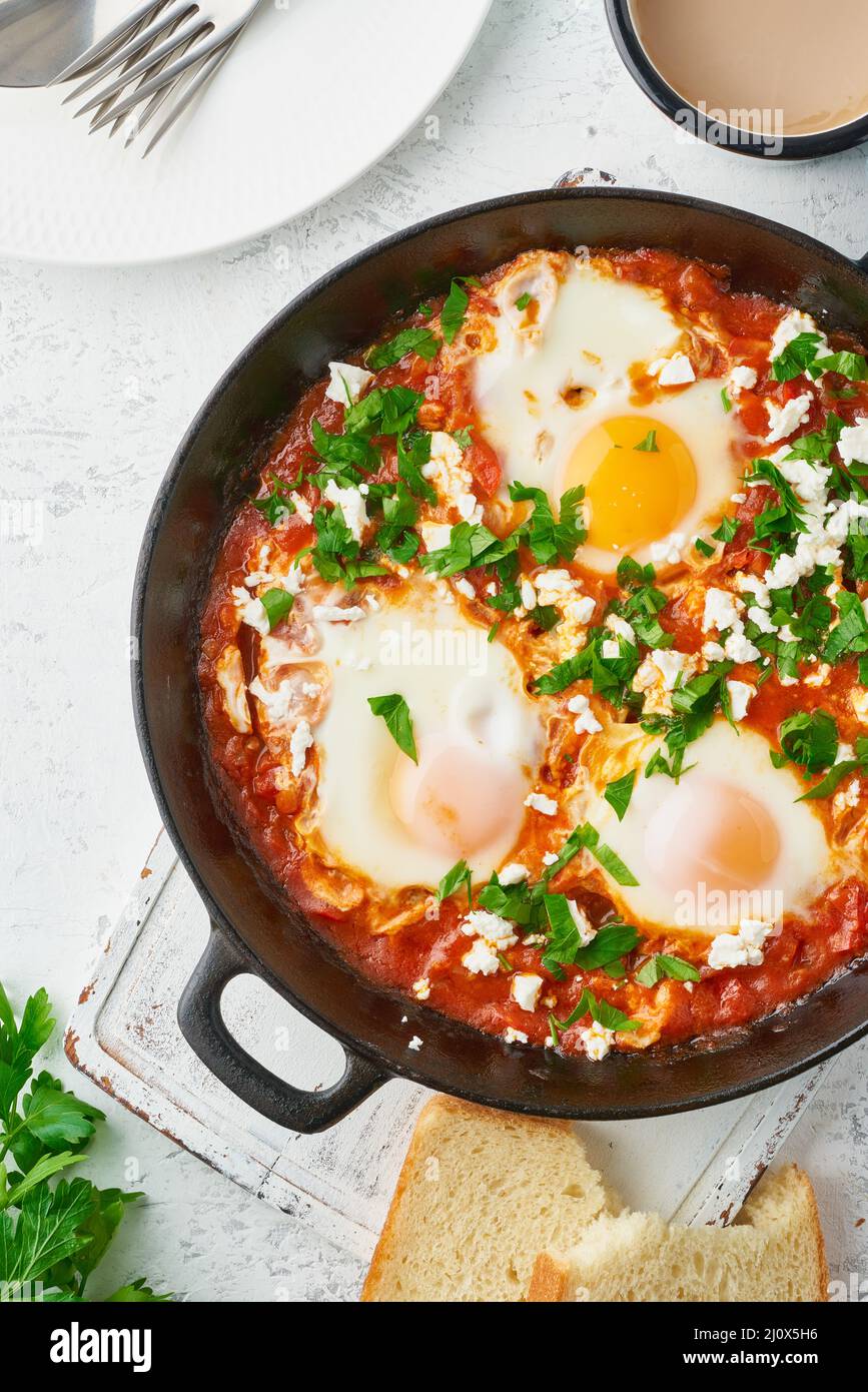 Shakshouka, eggs poached in sauce of tomatoes, olive oil. Mediterranean