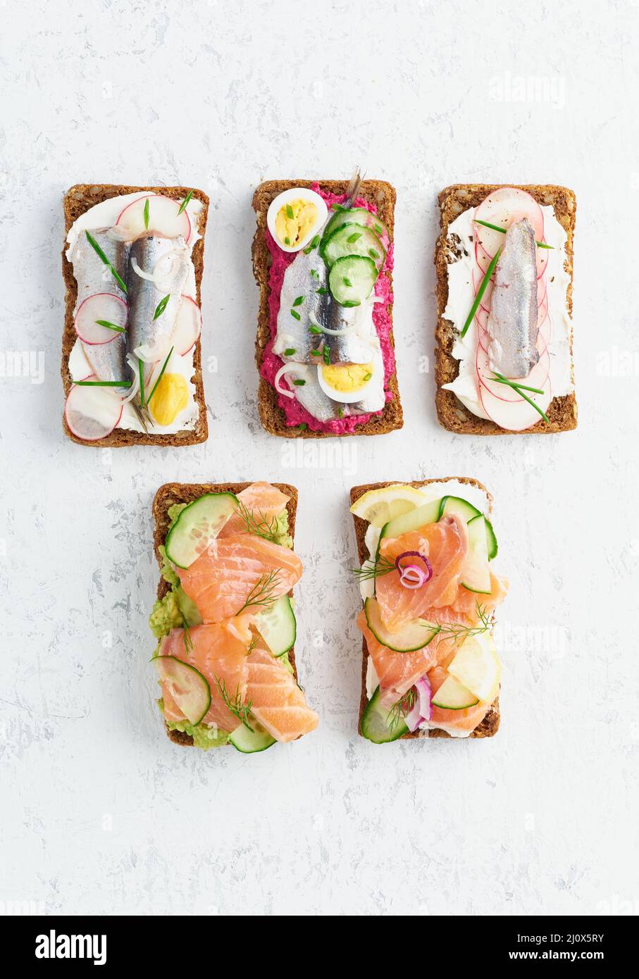 Savory fish smorrebrod, set of five traditional Danish sandwiches Stock Photo