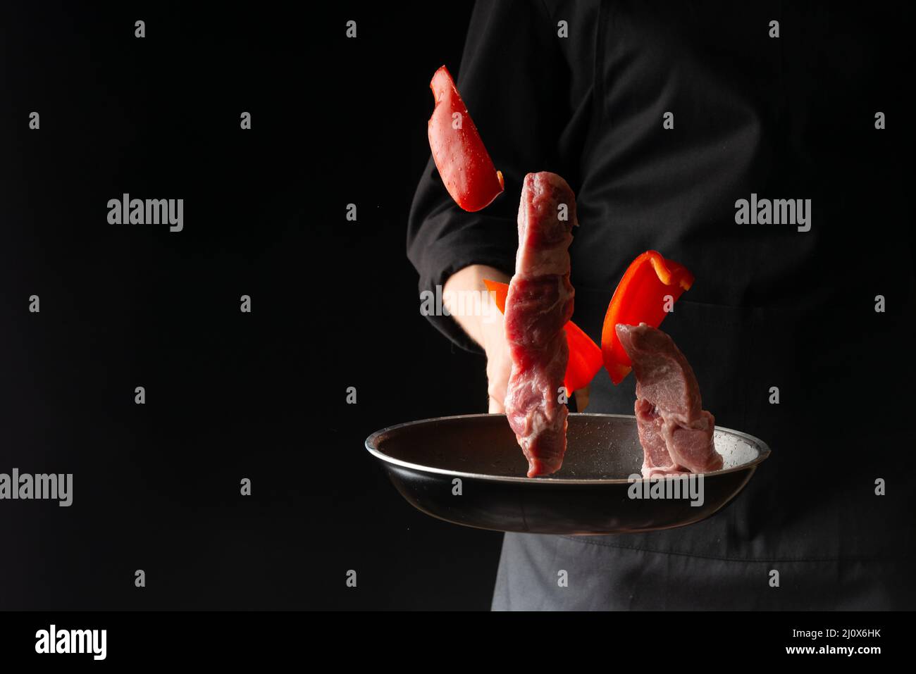 Chef prepares steaks from meat, pork or beef, throwing fresh meat with