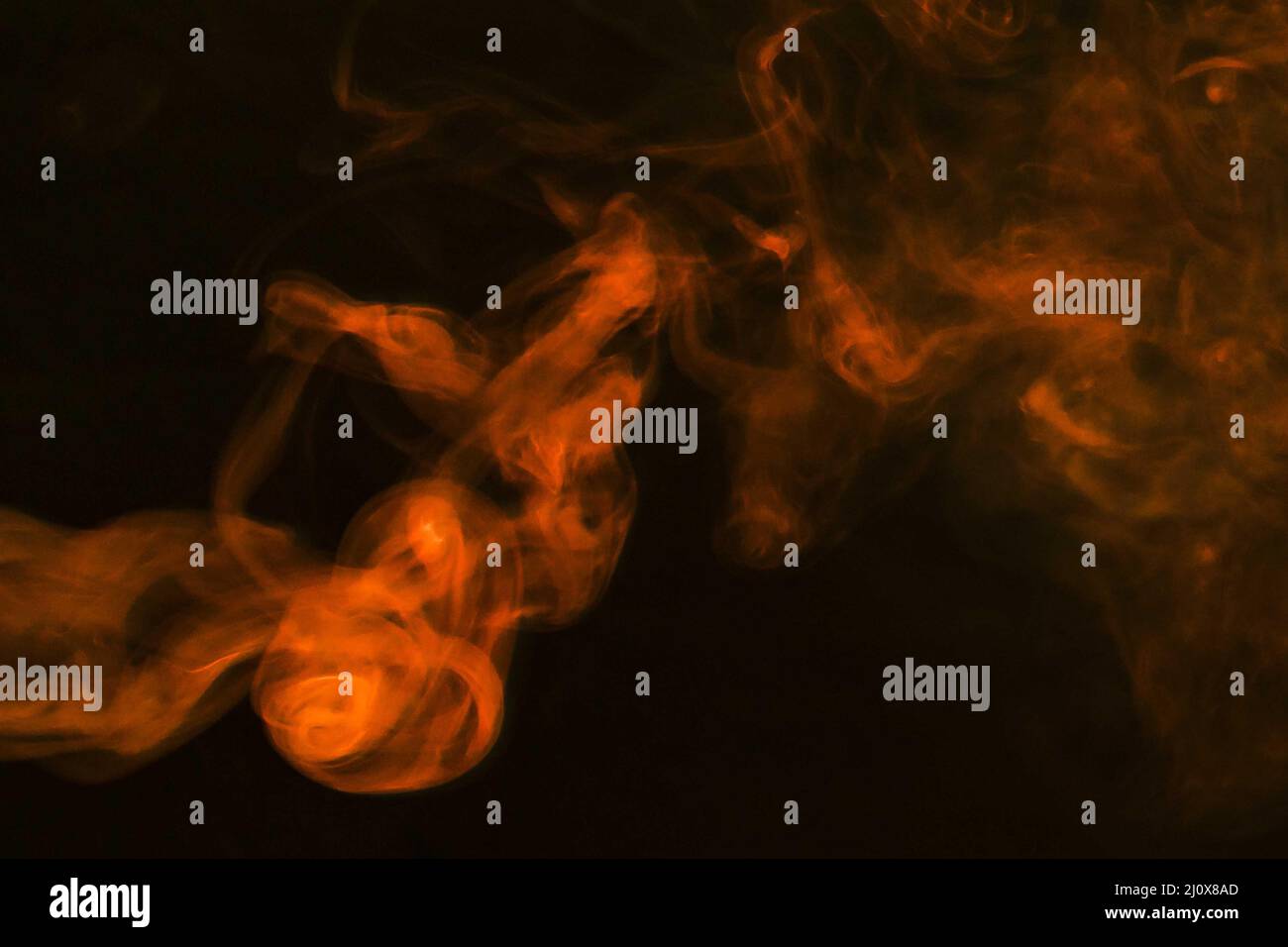 Dense fumes abstract orange smoke dark background. High quality photo Stock Photo